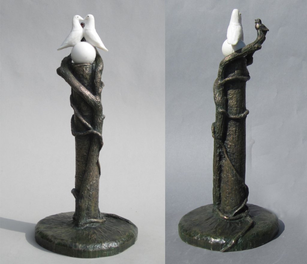 A thumbnail sculpture of two pigeons beak to beak for indoors act as a link to more information and a bigger image