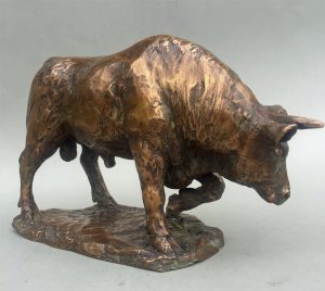 Front view of bronze sculpture of bull