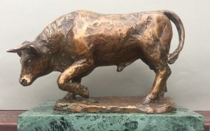 Bronze sculpture of bull on marble base