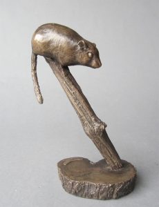 A small bronze sculpture of a dormouse