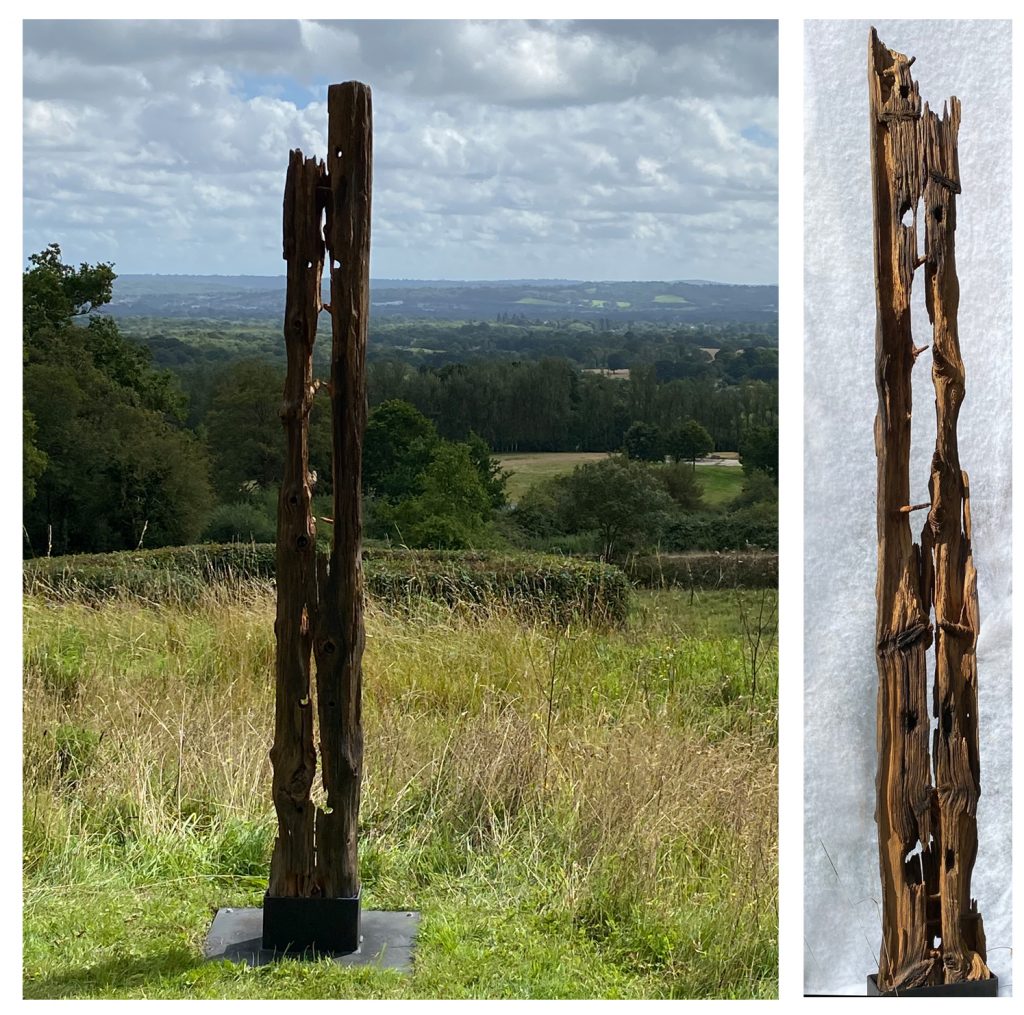 A restored post installed in an iron clamp and named LIFE AFTER DEATH and claimed to be a sculpture.