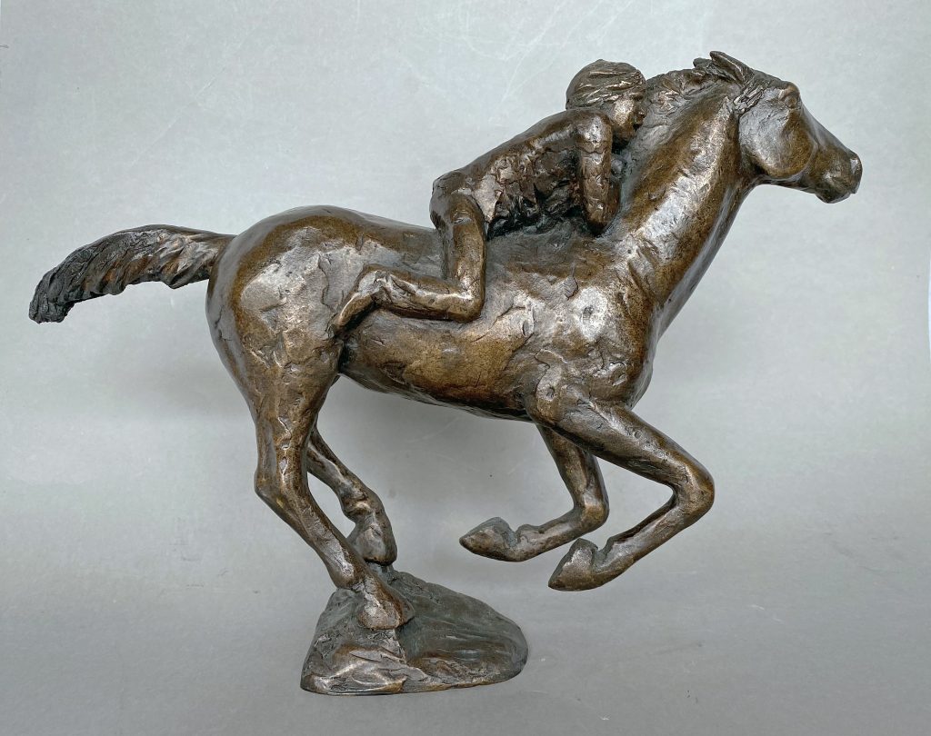 Bronze sculpture of bareback rider on a galloping horse